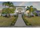 Stunning home exterior at dusk, showcasing architectural details and landscaping at 3925 1St Ne St, St Petersburg, FL 33703