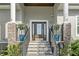 Elegant front entry with stone accents and a modern dark wood door at 3925 1St Ne St, St Petersburg, FL 33703