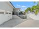 Home with attached two-car garage and stairs to patio at 3925 1St Ne St, St Petersburg, FL 33703