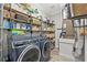 Laundry room with washer, dryer, and ample storage at 3925 1St Ne St, St Petersburg, FL 33703