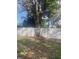 Backyard with a tree and empty sign at 4034 39Th N Ave, St Petersburg, FL 33714