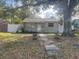 House with a walkway and large tree at 4034 39Th N Ave, St Petersburg, FL 33714