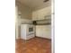 Simple kitchen with white cabinets and appliances at 4034 39Th N Ave, St Petersburg, FL 33714