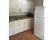 Efficient kitchen with white cabinets and appliances at 4034 39Th N Ave, St Petersburg, FL 33714