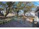 Wooden deck overlooking a backyard with mature trees at 4135 4Th N Ave, St Petersburg, FL 33713