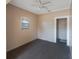 Spacious bedroom with carpet, ceiling fan, and closet at 4135 4Th N Ave, St Petersburg, FL 33713