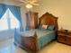 Bedroom with wooden furniture and a large window at 4209 Amber Ridge Ln, Valrico, FL 33594