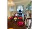 Bright dining room with a large table, set for a meal, overlooking the living room at 4209 Amber Ridge Ln, Valrico, FL 33594