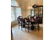 Formal dining room with dark wood table and chairs, and a large china cabinet at 4209 Amber Ridge Ln, Valrico, FL 33594