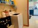 Laundry room with washer, dryer, and storage shelves at 4209 Amber Ridge Ln, Valrico, FL 33594