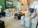 Bright living room with ample seating and views into the dining area at 4209 Amber Ridge Ln, Valrico, FL 33594