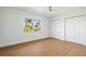 Bright bedroom with wood floors and double closets at 4320 Middle Lake Dr, Tampa, FL 33624