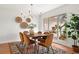 Bright dining room with wood table and stylish chairs at 4320 Middle Lake Dr, Tampa, FL 33624