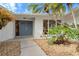 Inviting front entrance with double doors and lush landscaping at 4320 Middle Lake Dr, Tampa, FL 33624