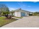 Home exterior showcasing a garage and walkway at 4320 Middle Lake Dr, Tampa, FL 33624