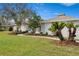 Landscaped yard with walkway leading to the home at 4320 Middle Lake Dr, Tampa, FL 33624