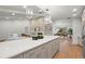 Modern kitchen island with white countertop and gray cabinets at 4320 Middle Lake Dr, Tampa, FL 33624