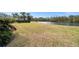 Expansive backyard with lake view and lush lawn at 4320 Middle Lake Dr, Tampa, FL 33624