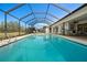 Refreshing screened pool with ample deck space at 4320 Middle Lake Dr, Tampa, FL 33624