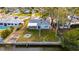 Aerial view of the house showing a single story home with backyard and dock at 4730 Shore Acres Ne Blvd, St Petersburg, FL 33703