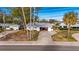 An aerial view of a single-Gathering home with a driveway and yard at 4730 Shore Acres Ne Blvd, St Petersburg, FL 33703