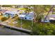 Aerial view showing house, boat lift and surrounding landscape at 4730 Shore Acres Ne Blvd, St Petersburg, FL 33703