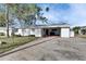 White single story home with carport and small front yard at 4730 Shore Acres Ne Blvd, St Petersburg, FL 33703