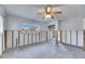 Living room with exposed walls and a ceiling fan at 4730 Shore Acres Ne Blvd, St Petersburg, FL 33703