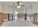 Large living room in need of renovation. Shows exposed supports and flooring at 4730 Shore Acres Ne Blvd, St Petersburg, FL 33703