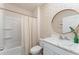 Clean bathroom with marble vanity and floral wallpaper at 5130 Adega Way, Bradenton, FL 34211