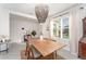 Elegant dining room with wood table and beaded chandelier at 5130 Adega Way, Bradenton, FL 34211