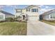 Two-story house with gray shutters and stone accents at 5130 Adega Way, Bradenton, FL 34211