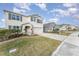 Two-story house with gray shutters and landscaped yard at 5130 Adega Way, Bradenton, FL 34211