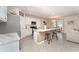 Bright kitchen featuring white cabinets and a large island at 5130 Adega Way, Bradenton, FL 34211