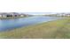 Community lake view with homes along the shoreline at 5130 Adega Way, Bradenton, FL 34211