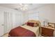 Well-lit bedroom featuring a double bed and wooden dresser at 5290 38Th S Way, St Petersburg, FL 33711