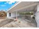 Covered carport with concrete parking area, providing shade and protection at 5290 38Th S Way, St Petersburg, FL 33711