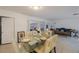 Dining room with glass top table and view of living room at 5290 38Th S Way, St Petersburg, FL 33711