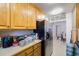 Kitchen features stainless steel appliances and wood cabinets at 5290 38Th S Way, St Petersburg, FL 33711