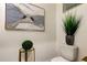 Elegant powder room with a pedestal sink, decorative artwork, and potted plant at 5453 Del Coronado Dr, Apollo Beach, FL 33572