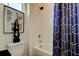 Clean bathroom with a bathtub, shower, and artistic wall decor at 5453 Del Coronado Dr, Apollo Beach, FL 33572