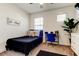 Cozy bedroom with a bed, desk and chair, and large window at 5453 Del Coronado Dr, Apollo Beach, FL 33572