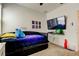 Spacious ' bedroom with a daybed, TV, and game-themed decor at 5453 Del Coronado Dr, Apollo Beach, FL 33572