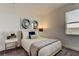 Bedroom with a queen bed, nightstand, and window with blinds at 5453 Del Coronado Dr, Apollo Beach, FL 33572