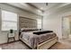 Spacious bedroom with large bed, window blinds, and a nightstand at 5453 Del Coronado Dr, Apollo Beach, FL 33572