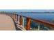 Curved boardwalk path with wooden railing and lake view at 5453 Del Coronado Dr, Apollo Beach, FL 33572