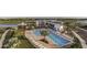 Community pool with lounge chairs and adjacent clubhouse at 5453 Del Coronado Dr, Apollo Beach, FL 33572