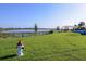 Dog park with grassy area, lake view, and fire hydrant at 5453 Del Coronado Dr, Apollo Beach, FL 33572