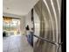 Modern kitchen with stainless steel refrigerator and access to backyard at 5453 Del Coronado Dr, Apollo Beach, FL 33572