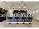Modern kitchen island with black cabinets and quartz countertops at 5453 Del Coronado Dr, Apollo Beach, FL 33572